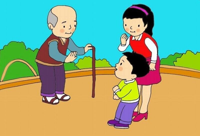 Một em bé đang vẫy tay chào thể hiện kỹ năng giao tiếp cơ bản