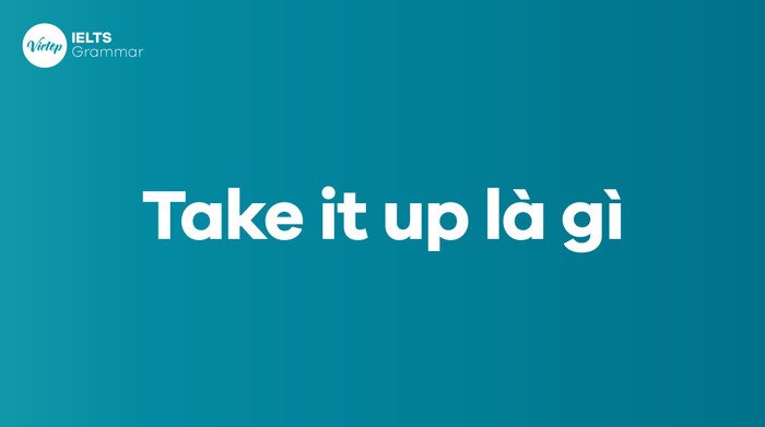 Bàn tay nhặt hoặc cầm nắm một vật, minh họa ý nghĩa của 'take up' trong tiếng Anh