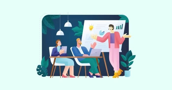 Một diễn giả đang mỉm cười và giơ tay cảm ơn khán giả, minh họa cách bày tỏ lòng tri ân sau bài thuyết trình tiếng Anh chuyên nghiệp.