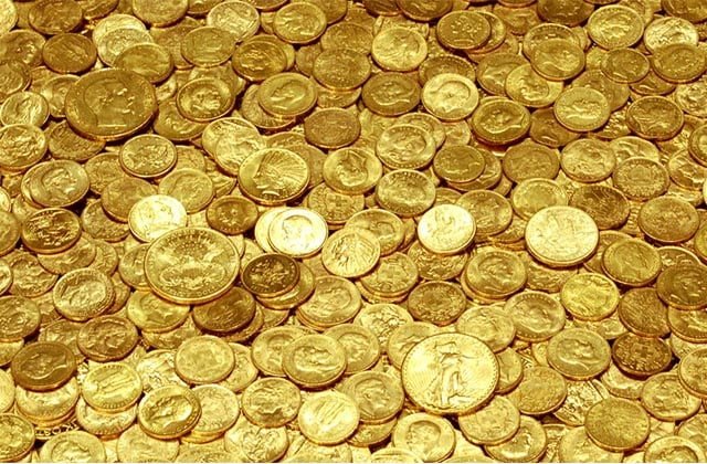 Giấc mơ thấy tiền xu bằng vàng báo hiệu tài lộc và công nhận xứng đáng