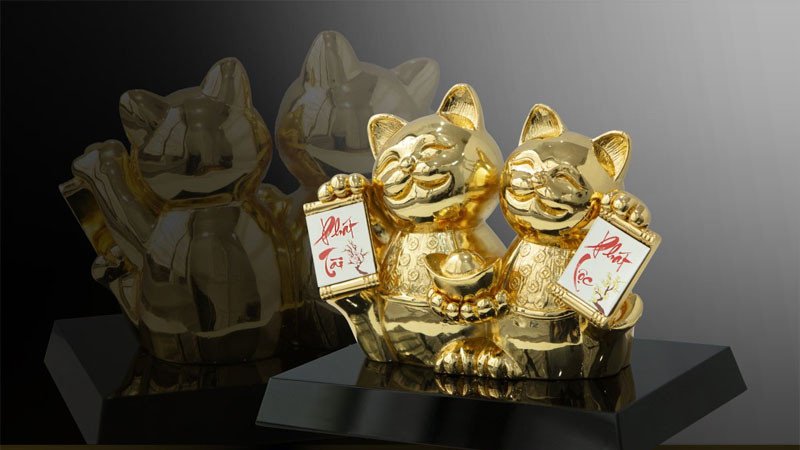 Hình nền mèo Thần Tài với ánh mắt lấp lánh, mang đến sự sáng suốt và may mắn trong học tập